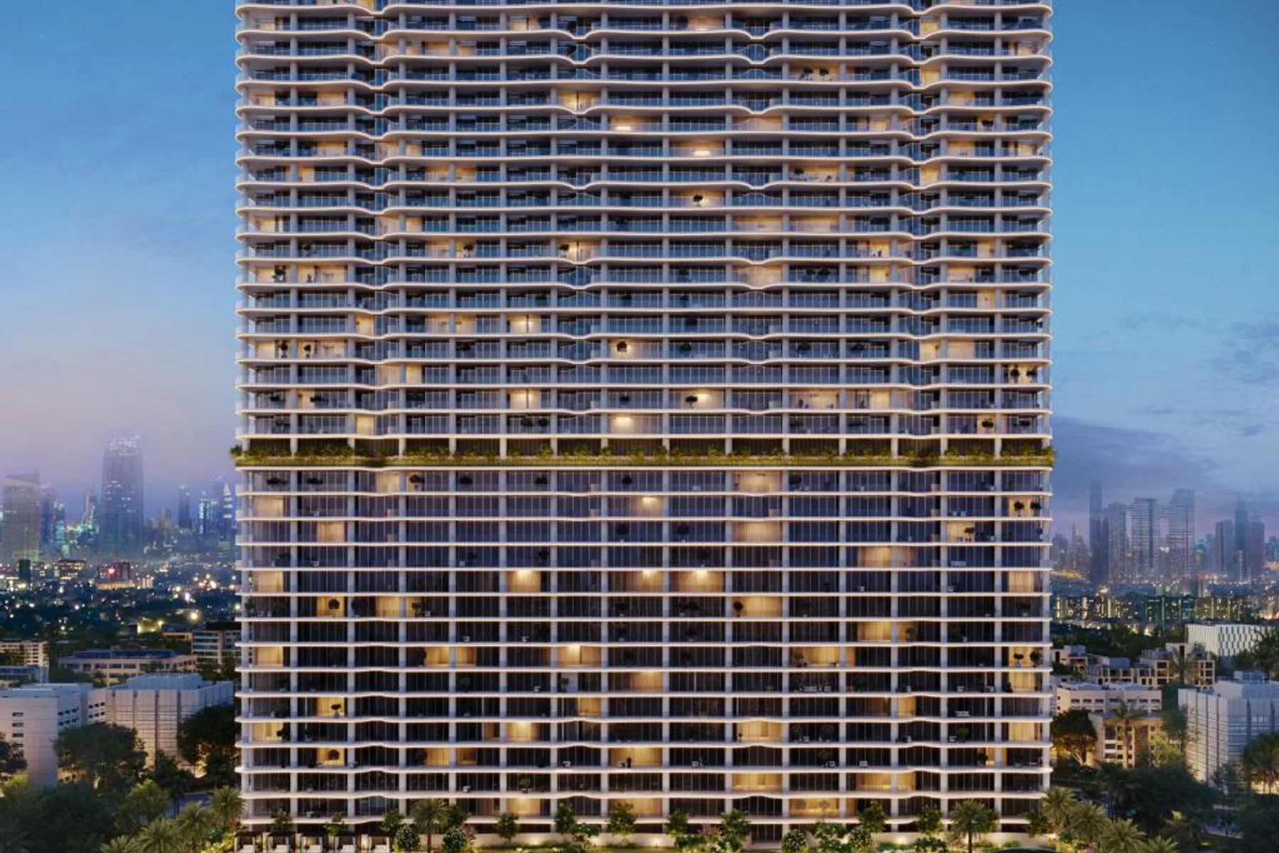The WOW Tower at dusk with pool deck and podium